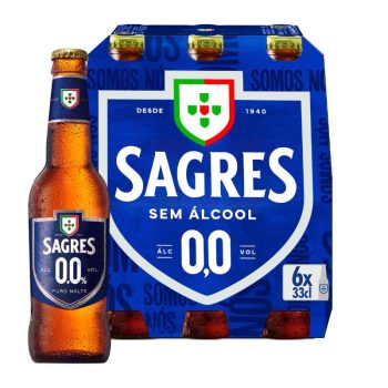 Bottle of Sagres 0.0% non-alcoholic beer beside a blue six-pack of Sagres 0.0% beer