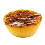 Custard tart with a caramelized, glossy top and golden crust, shown on a white background.