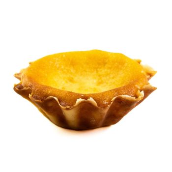 Golden-brown empty tart shell on a white background, fluted edges visible.