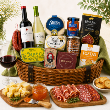Gourmet charcuterie basket with wine, cheeses, cured meats, crackers, and jams for a celebration.