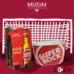 WCUP 2026 - BALDE DE GELO 1 - Delícias Delicias promo image featuring a four-pack of Super Bock beer and a red Super Bock bucket in front of a white grid backdrop on a maroon background with a 2026 soccer graphic.