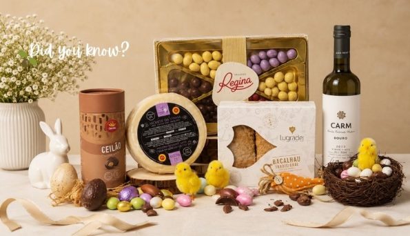 Easter gift spread: chocolates, wine, nest with eggs, and yellow chicks on a beige backdrop.
