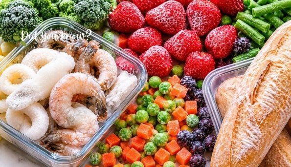 Colorful spread of snacks and produce: sugar-dusted ring pastries, bread, berries, vegetables, and diced items arranged together.