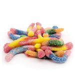 Pile of multicolored sour gummy candies coated in sugar on a white background.