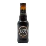 Brown glass bottle of Super Bock Stout beer with a gold-and-black label on a white background, cap on top and condensation visible on the bottle edge.