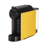 Compact yellow and black single-serve espresso machine with a front drip tray and rear water reservoir.