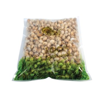 Clear plastic bag filled with pistachio nuts in shells, with green branding at the bottom edge of the bag.