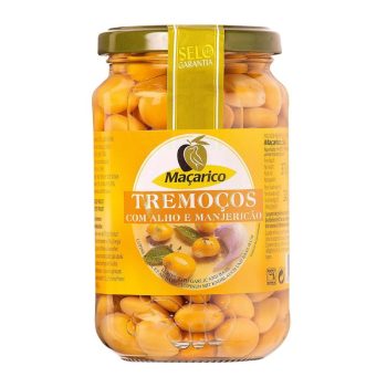 Jar of Maçarico tremoços (lupini beans) in oil, with garlic and basil, on a yellow label bottle display