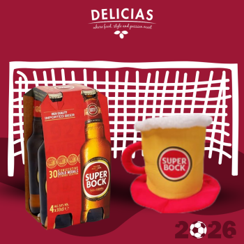 Delicias advertisement showing a six-pack of Super Bock beer bottles beside a frothy beer mug against a white lattice backdrop.