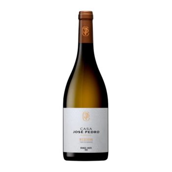 Bottle of Casa José Pedro Reserva Branco white wine with gold foil capsule and white label against a white background