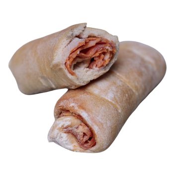 Two crusty bread rolls stuffed with ham, dusted with flour on the outside, shown crosswise for filling visible]