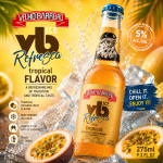 Velho Barreiro Ice Refresca tropical bottle surrounded by ice and tropical fruit slices, advertising a tropical-flavor drink.