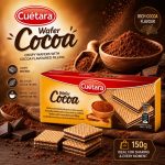Cuétara Cocoa Wafer box with cocoa-flavoured wafers and loose cocoa powder around it, 150 g, ideal for sharing.